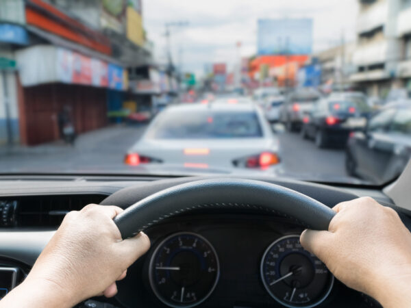 Hands holding steering car in the traffic jam ,Thailand Hands holding steering car in the traffic jam ,Thailand